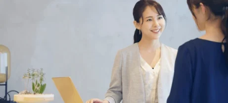 young-asian-receptionist-talking-customers-600nw-1774447547 young-asian-receptionist-talking-customers-600nw-1774447547